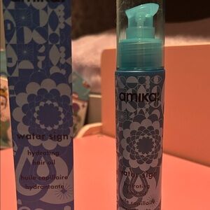 Amika Water Sign Hair Oil in Blue Packaging
